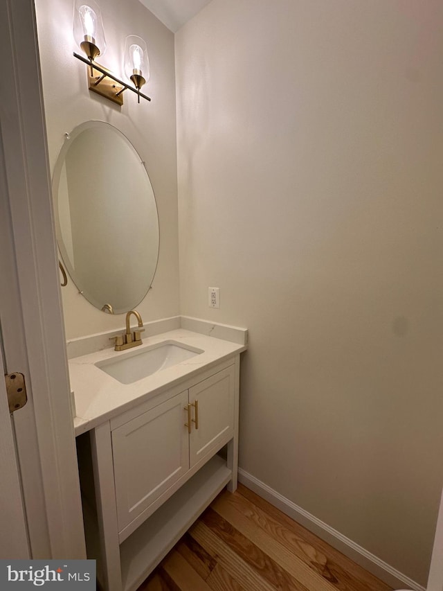 bathroom with vanity and wood-type flooring