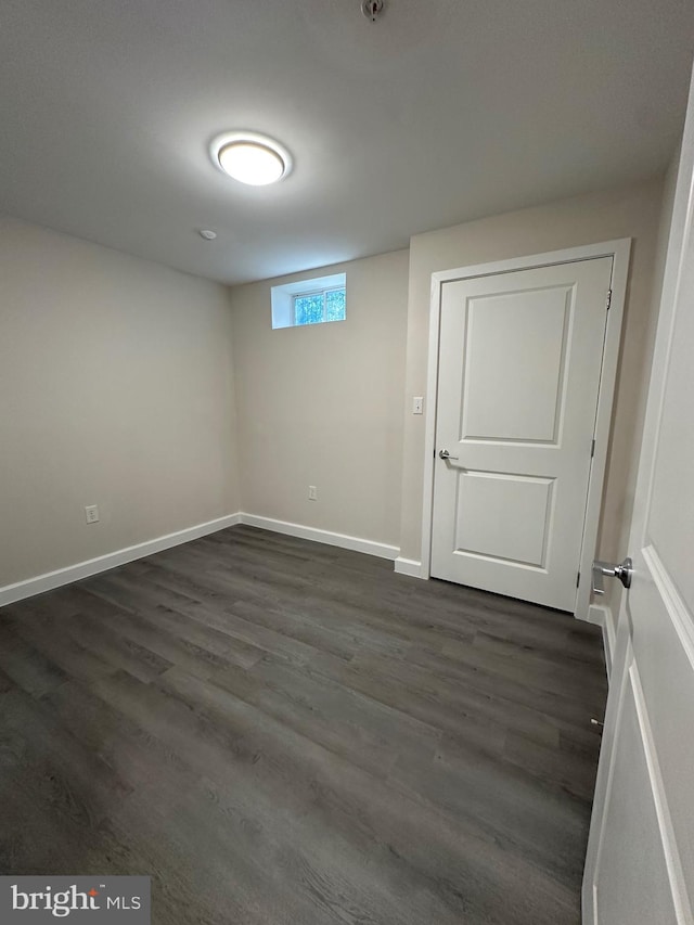 basement featuring dark wood-type flooring