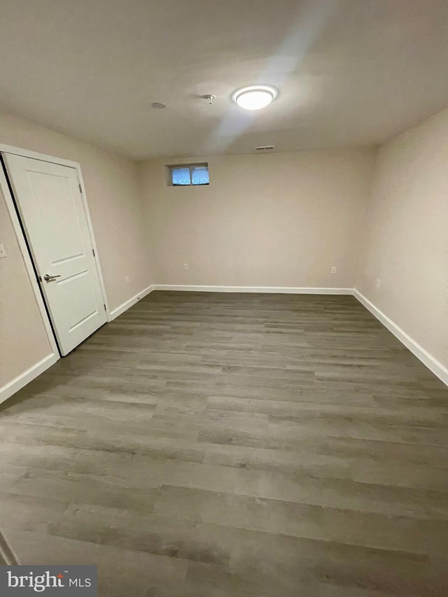 basement featuring hardwood / wood-style floors