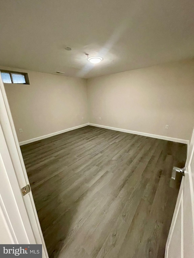 empty room with hardwood / wood-style flooring