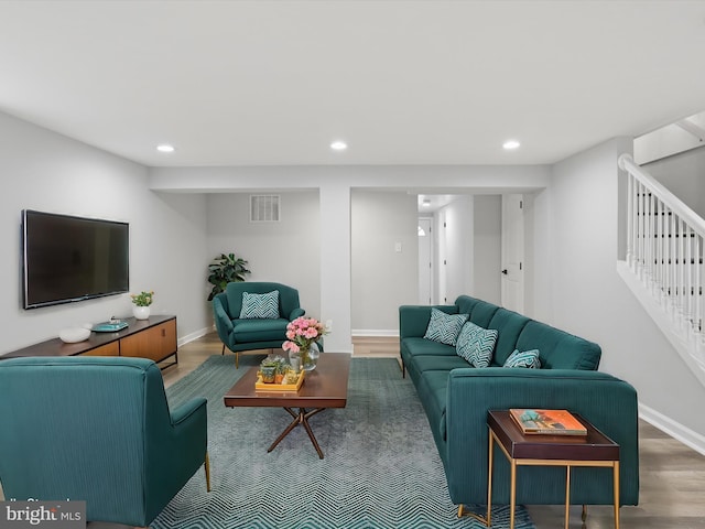 living room with dark hardwood / wood-style flooring