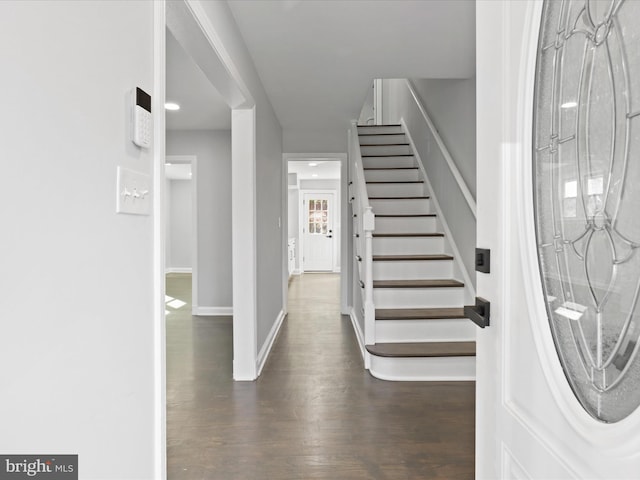 foyer entrance with dark wood-type flooring