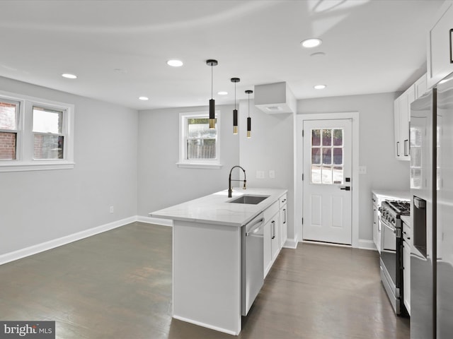 kitchen featuring a healthy amount of sunlight, sink, hanging light fixtures, stainless steel appliances, and white cabinets