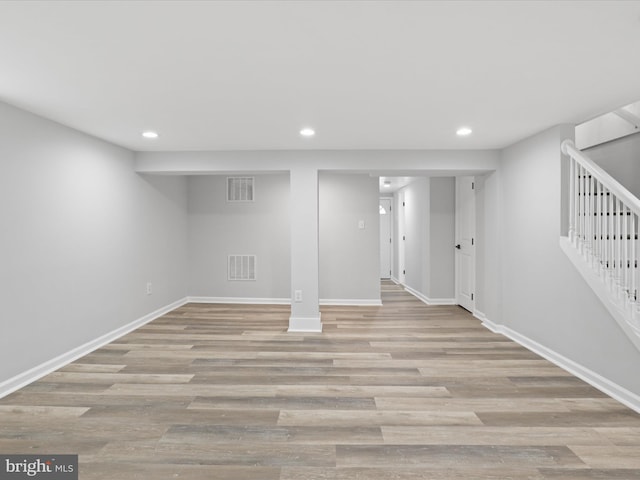 basement featuring light hardwood / wood-style floors