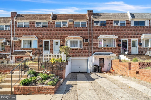 multi unit property with cooling unit and a garage