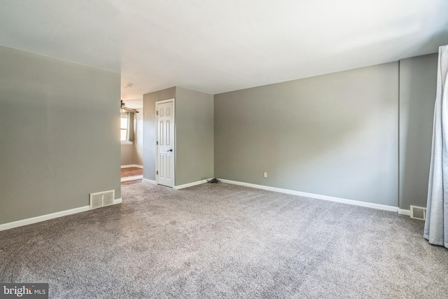 unfurnished room featuring carpet floors