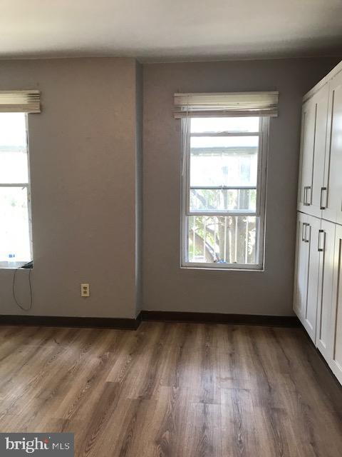 unfurnished bedroom featuring wood finished floors
