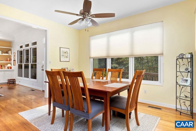 dining area featuring light hardwood / wood-style floors and ceiling fan