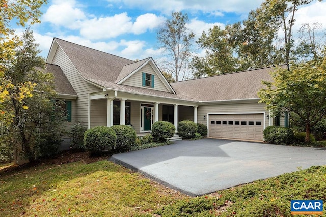 view of front of house featuring a front yard and a garage