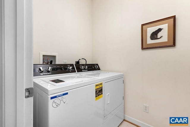 clothes washing area with washer and dryer