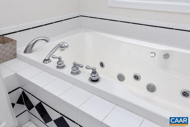 details featuring tiled tub