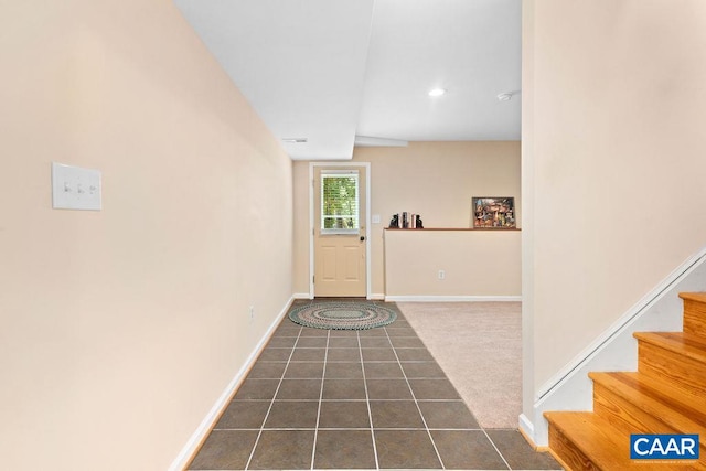 view of carpeted foyer