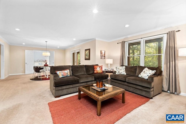 carpeted living room with ornamental molding