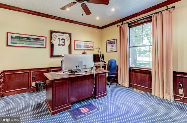 home office featuring ornamental molding, dark colored carpet, and ceiling fan