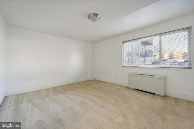 spare room with light colored carpet