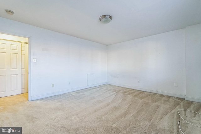 spare room with light carpet