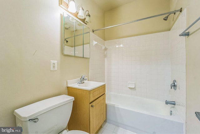 full bathroom featuring vanity, tile patterned floors, tiled shower / bath combo, and toilet