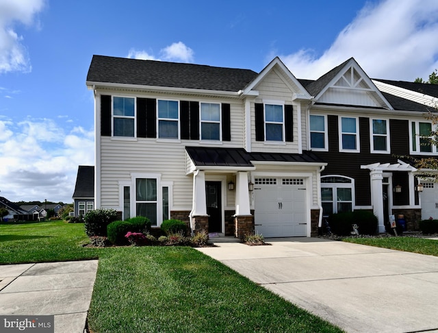 view of front of property with a front lawn and a garage