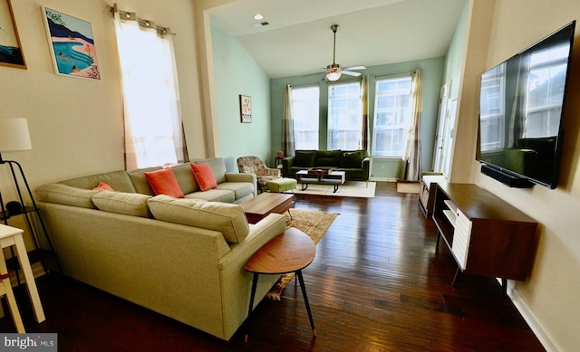 living room featuring lofted ceiling, dark hardwood / wood-style floors, and ceiling fan