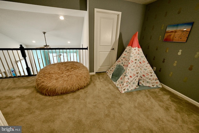 rec room with carpet and ceiling fan