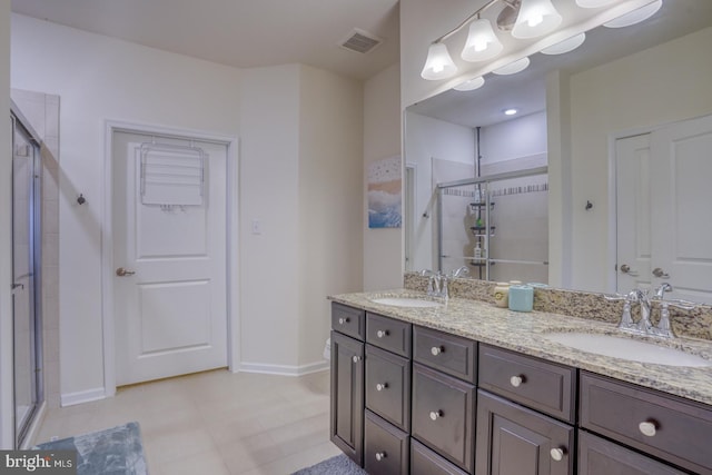 bathroom with vanity and an enclosed shower