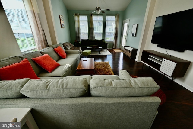 living room with lofted ceiling, dark hardwood / wood-style floors, and ceiling fan