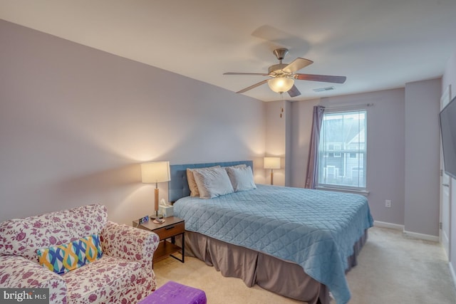 bedroom with light carpet and ceiling fan