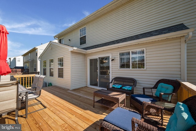 wooden terrace featuring outdoor lounge area