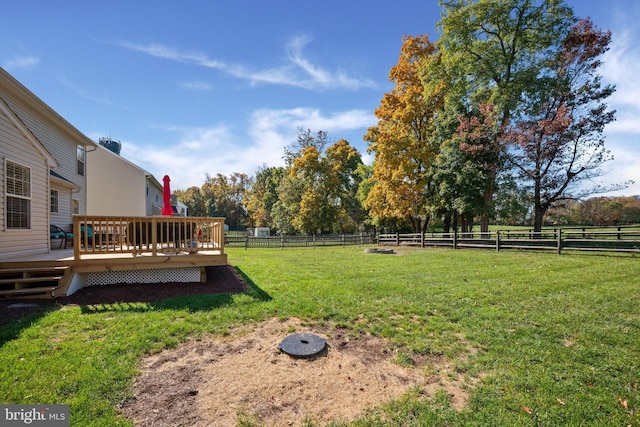 view of yard featuring a rural view and a deck