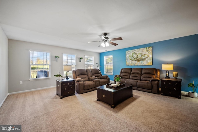 carpeted living room featuring ceiling fan