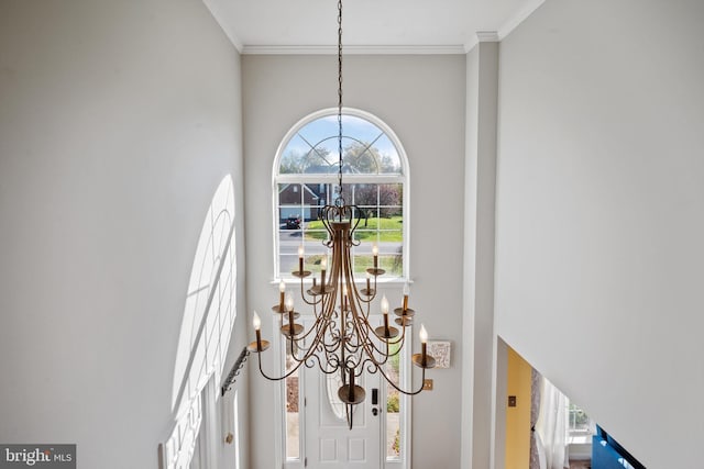 room details with ornamental molding and a notable chandelier