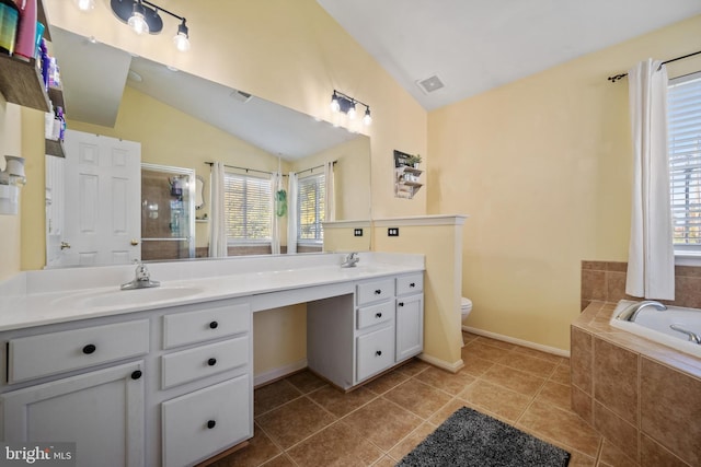 full bathroom featuring tile patterned floors, toilet, separate shower and tub, vaulted ceiling, and vanity