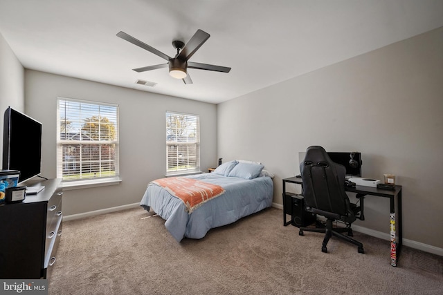 carpeted bedroom with ceiling fan