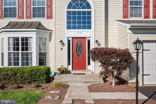 property entrance with a garage