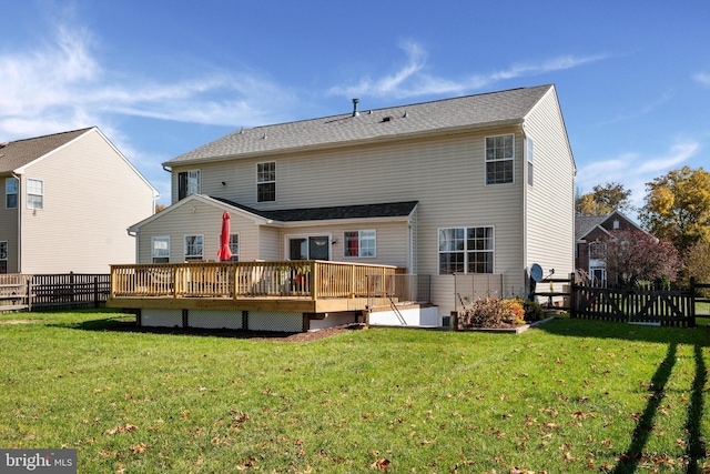 back of property featuring a yard and a deck