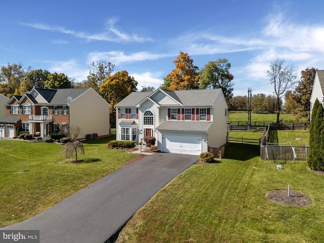 view of front of house featuring a garage and a front yard