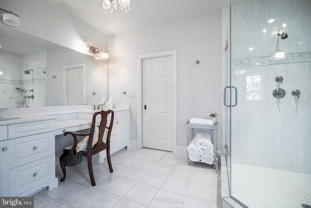 bathroom featuring vanity and a shower with shower door