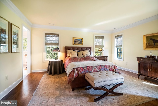 bedroom featuring crown molding and hardwood / wood-style floors