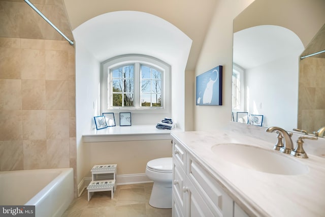 full bathroom with vanity, toilet, lofted ceiling, and tiled shower / bath