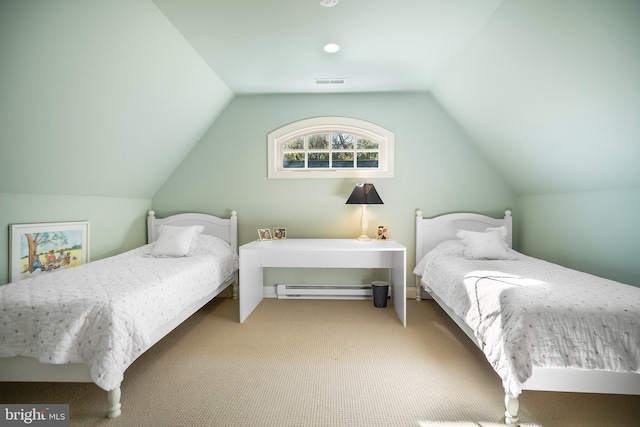 carpeted bedroom with lofted ceiling and a baseboard heating unit