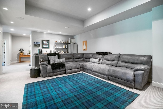 carpeted living room featuring indoor bar