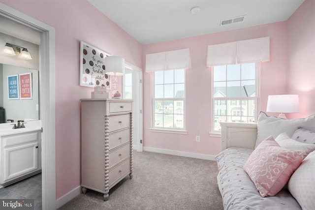 bedroom with light carpet and sink