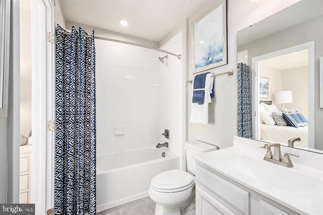 full bathroom featuring vanity, toilet, tile patterned floors, and shower / bath combo