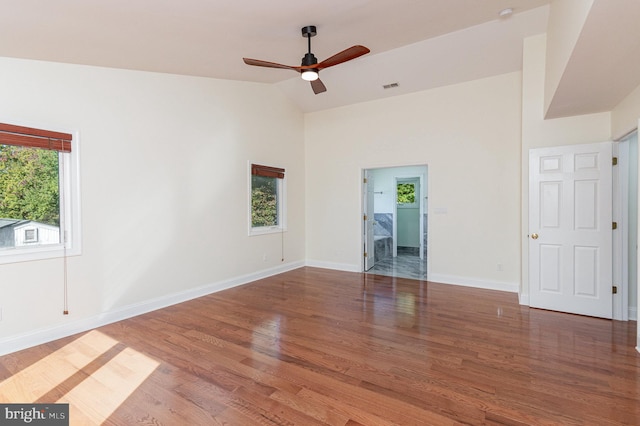 spare room featuring ceiling fan, vaulted ceiling, and hardwood / wood-style floors