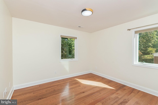 spare room featuring hardwood / wood-style floors