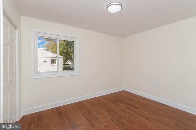 empty room with wood-type flooring