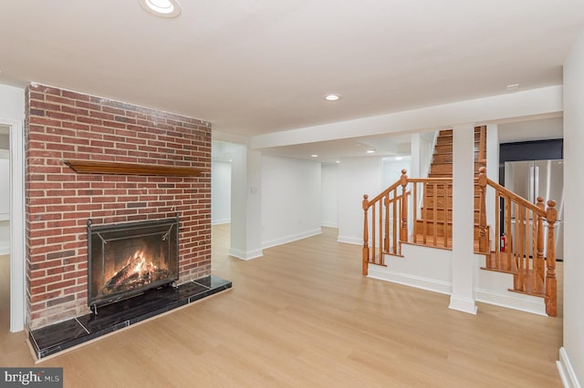 unfurnished living room with light hardwood / wood-style floors and a fireplace