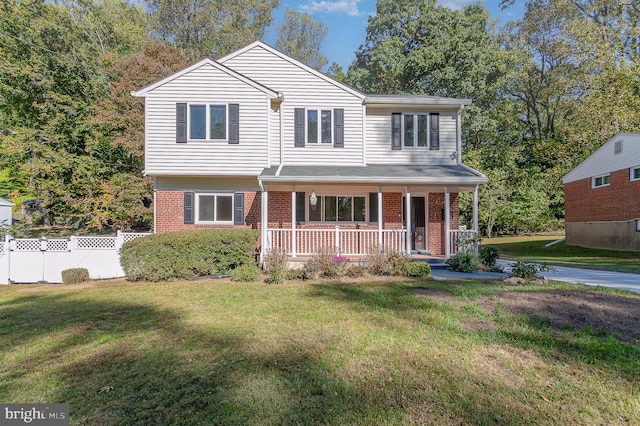 view of front of home with a front lawn and covered porch