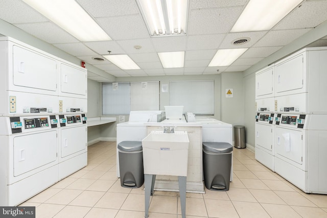 laundry room featuring sink, separate washer and dryer, and stacked washer and clothes dryer