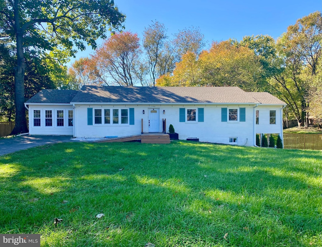 ranch-style house with a front lawn